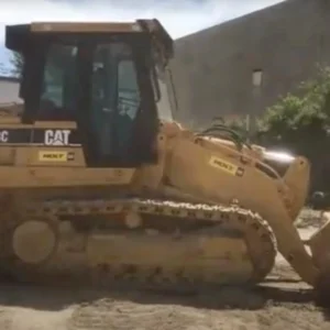 Caterpillar CAT 953C crawler-style loader with rippers.