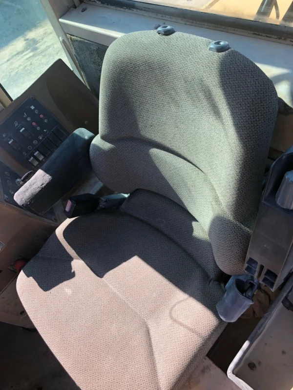 Driver seat of a 1996 Cat 950F II wheel loader.