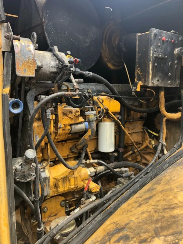 Open engine compartment of a 1996 Cat 950F II wheel loader.